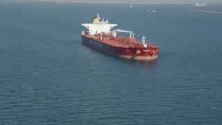 4.8K aerial stock footage approach an oil tanker anchored in San Pedro Bay in Long Beach, California Aerial Stock Footage | AX68_080