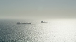 AX68_084 - 4.8K aerial stock footage of two oil tankers sailing the Pacific Ocean