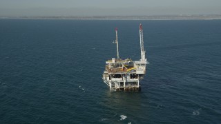 4.8K aerial stock footage orbit of an oil platform off the California Coast, near Long Beach Aerial Stock Footage | AX68_099