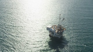 4.8K aerial stock footage orbit of an oil platform off the coast of California near Long Beach Aerial Stock Footage | AX68_101