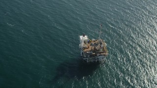 4.8K aerial stock footage of bird's eye view of an oceanic oil platform off the California Coast near Long Beach Aerial Stock Footage | AX68_102