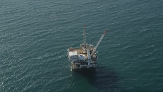 4.8K aerial stock footage of flyby an oil platform just off the California Coast, Long Beach Aerial Stock Footage | AX68_106