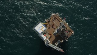 4.8K aerial stock footage of a bird's eye view of an oil derrick near Long Beach, California Aerial Stock Footage | AX68_109