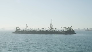 AX68_127 - 4.8K aerial stock footage of an approach to Island Chaffee in San Pedro Bay, Long Beach, California