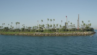 4.8K aerial stock footage flyby Island Chaffee oil drilling island in San Pedro Bay, Long Beach, California Aerial Stock Footage | AX68_128