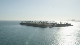 AX68_130 - 4.8K aerial stock footage flyby Island Freeman oil drilling island in San Pedro Bay, Long Beach, California