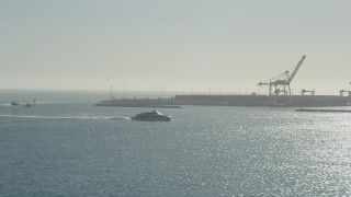 AX68_131 - 4.8K aerial stock footage of a ferry sailing across San Pedro Bay in Long Beach, California