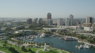 4.8K aerial stock footage fly over lighthouse, Shoreline Aquatic Park, and aquarium to approach office buildings in Downtown Long Beach, California Aerial Stock Footage | AX68_136