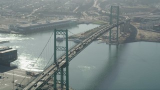 4.8K aerial stock footage approach cars crossing the Vincent Thomas Bridge in the Port of Los Angeles, California Aerial Stock Footage | AX68_148