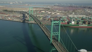 4.8K aerial stock footage of cars and trucks crossing the Vincent Thomas Bridge at the Port of Los Angeles, California Aerial Stock Footage | AX68_151