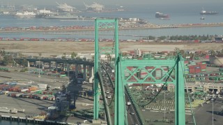 4.8K aerial stock footage flyby Vincent Thomas Bridge with light traffic at the Port of Los Angeles, California Aerial Stock Footage | AX68_155