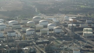 AX68_172 - 4.8K aerial stock footage of passing tanks at the Los Angeles Refinery Wilmington Plant in San Pedro, California