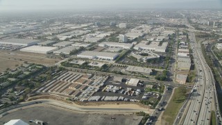 4.8K aerial stock footage approach office and warehouse buildings by I-110 in Torrance, California Aerial Stock Footage | AX68_180