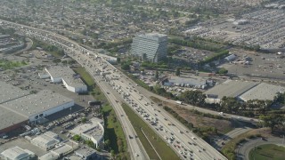 AX68_183 - 4.8K aerial stock footage of heavy traffic on Interstate 405 through Torrance, California