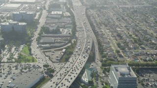 4.8K aerial stock footage of heavy traffic on I-405 between office buildings and homes in Torrance, California Aerial Stock Footage | AX68_184