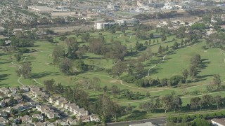 4.8K aerial stock footage of golfers and carts at Chester Washington Golf Course in Hawthorne, California Aerial Stock Footage | AX68_190