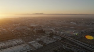 AX69_003 - 4.8K aerial stock footage of sunset at the Los Angeles International Airport in California