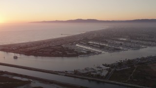 AX69_020 - 4.8K aerial stock footage approach coastal community of Marina Del Rey at sunset, California