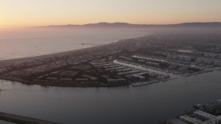 AX69_021 - 4.8K aerial stock footage approach apartment buildings and neighborhoods in Marina Del Rey, California, at sunset