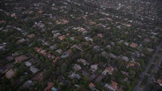 4.8K aerial stock footage fly over mansions and upscale homes at twilight in Brentwood, California Aerial Stock Footage | AX69_050