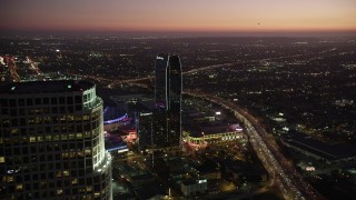 AX69_091 - 4.8K aerial stock footage flyby 777 Tower to reveal The Ritz-Carlton and Staples Center in Downtown Los Angeles at twilight, California