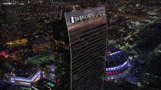 AX69_093 - 4.8K aerial stock footage of the top of the Ritz-Carlton Hotel in Downtown Los Angeles, California at twilight