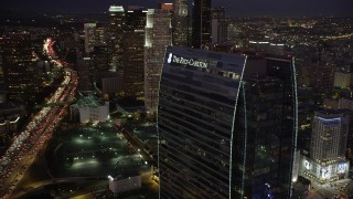 AX69_094 - 4.8K aerial stock footage flyby the Ritz-Carlton Hotel to reveal skyscrapers in Downtown Los Angeles at night