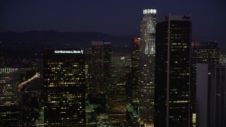 4.8K aerial stock footage fly between skyscrapers in Downtown Los Angeles, California at night Aerial Stock Footage | AX69_100