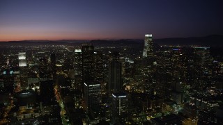 4.8K aerial stock footage pan across Downtown Los Angeles skyscrapers at night, California Aerial Stock Footage | AX69_110