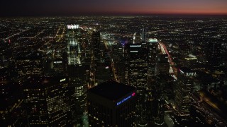 4.8K aerial stock footage pan and approach US Bank Tower in Downtown Los Angeles, California at night Aerial Stock Footage | AX69_121