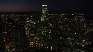 4.8K aerial stock footage of US Bank Tower and skyscrapers in Downtown Los Angeles, California at night Aerial Stock Footage | AX69_130