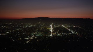 4.8K aerial stock footage of bright lights of Hollywood streets at night, California Aerial Stock Footage | AX69_136