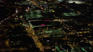 AX69_143 - 4.8K aerial stock footage approach and fly over Burbank Town Center in Burbank, California at night