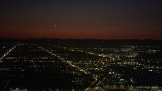 AX69_144 - 4.8K aerial stock footage of suburban neighborhoods at nighttime in Burbank, California