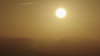 4K aerial stock footage View of the sunrise over the mountains Aerial Stock Footage | AX70_002