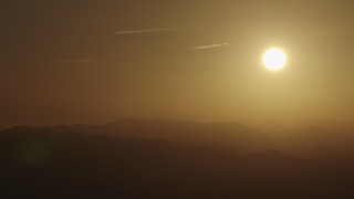 4K aerial stock footage The rising sun over mountains Aerial Stock Footage | AX70_004