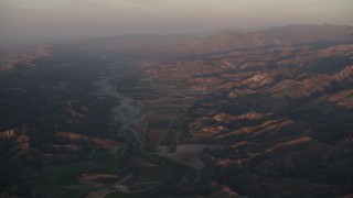 4K aerial stock footage Farm fields by the Santa Clara River at sunrise, Piru, California Aerial Stock Footage | AX70_007