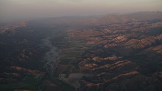 4K aerial stock footage Farmland by the Santa Clara River at sunrise, Piru, California Aerial Stock Footage | AX70_008