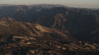 4K aerial stock footage Rugged slopes and mountain ridge at sunrise in Los Padres National Forest, California Aerial Stock Footage | AX70_013