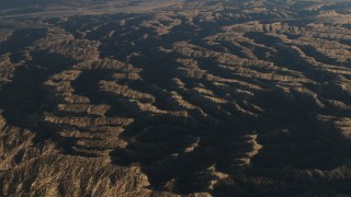 4K aerial stock footage of A view of mountain ridges in Los Padres National Forest at sunrise, California Aerial Stock Footage | AX70_020