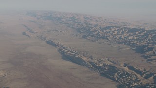 4K aerial stock footage Wide view of the San Andreas Fault, the Temblor Range, and desert plains in Southern California Aerial Stock Footage | AX70_036