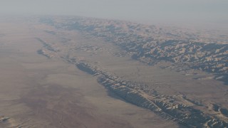 AX70_037 - 4K aerial stock footage of A view of the San Andreas Fault, the Temblor Range, and desert plains in Southern California