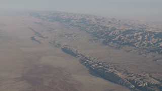 4K aerial stock footage of The San Andreas Fault in a desert plain by the Temblor Range in Southern California Aerial Stock Footage | AX70_038