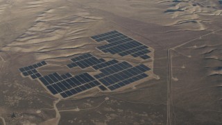 4K aerial stock footage Tilt to a bird's eye view of large solar arrays at the Topaz Solar Farm in the Carrizo Plain, California Aerial Stock Footage | AX70_055