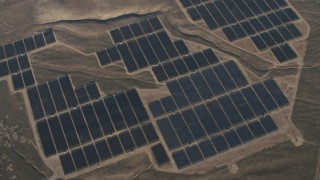 4K aerial stock footage Tilt to a bird's eye of solar panels at the Topaz Solar Farm in the Carrizo Plain, California Aerial Stock Footage | AX70_056