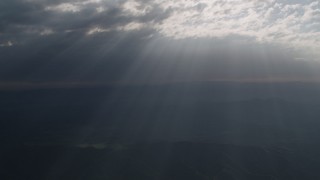 4K aerial stock footage Godrays shining through the clouds over San Luis Obispo County, California Aerial Stock Footage | AX70_074