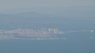 4K aerial stock footage Downtown San Francisco and the Bay Bridge as commercial jets pass, California Aerial Stock Footage | AX70_091