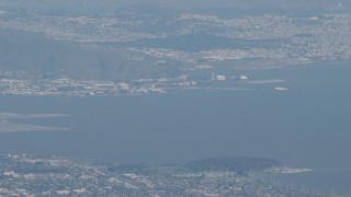 4K aerial stock footage Commercial airliner flying near San Francisco International Airport in California Aerial Stock Footage | AX70_096