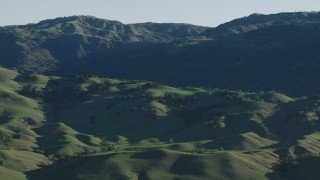 AX70_100 - 4K aerial stock footage Green hills and mountains in springtime, Gilroy, California