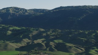 AX70_101 - 4K aerial stock footage Flyby green hills and mountains in springtime, Gilroy, California